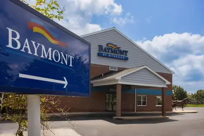 a bank sign in front of a building at Baymont by Wyndham Lancaster PA Dutch Country in Lancaster