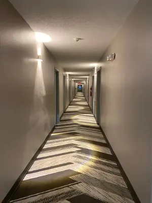 a long hallway with a long at Baymont by Wyndham Pine Grove I-81 in Pine Grove