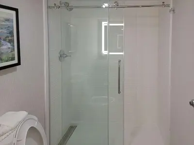 a glass shower in a bathroom with a toilet at Comfort Inn & Suites Wyomissing-Reading in Wyomissing