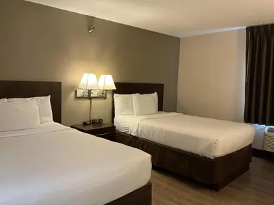 a hotel room with two beds and a window at Quality Inn Wilkes-Barre near Arena in Wilkes-Barre