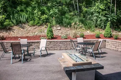 a group of chairs and tables in a patio at Econo Lodge Williamsport in Williamsport
