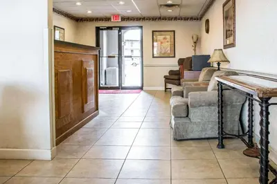a living room with a couch and a table at Econo Lodge Williamsport in Williamsport