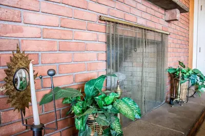 a brick wall with a window with plants in it at Econo Lodge Williamsport in Williamsport