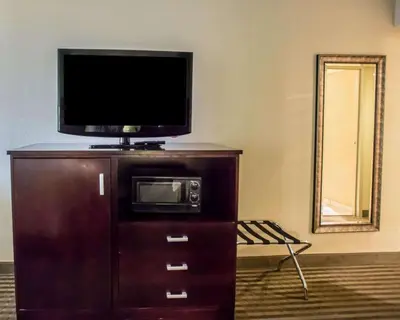 a flat screen tv on top of a dresser at Quality Inn Mill Hall - Lamar in Clintondale