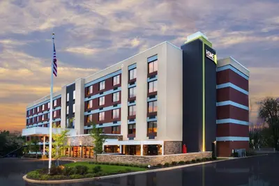 a hotel with an american flag in front of it at Home2 Suites By Hilton King Of Prussia Valley Forge in King of Prussia