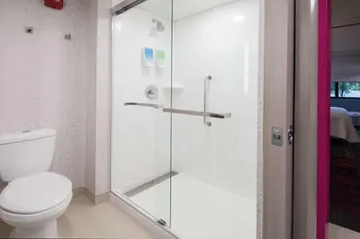 a bathroom with a toilet and a glass shower at Home2 Suites By Hilton King Of Prussia Valley Forge in King of Prussia