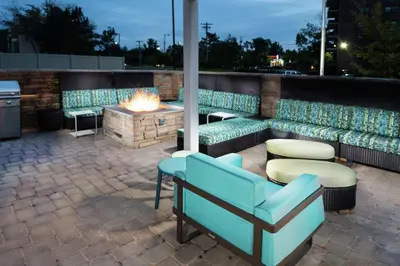 a patio with furniture and a fire pit at Home2 Suites By Hilton King Of Prussia Valley Forge in King of Prussia