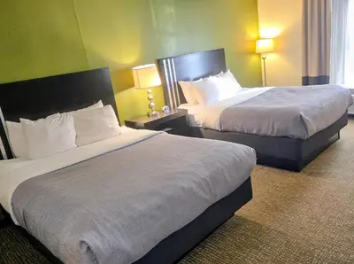 a hotel room with two beds and two lamps at Quality Inn Selinsgrove in Selinsgrove