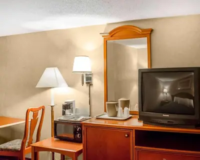 a hotel room with a television on a desk at Rodeway Inn Dillsburg in Dillsburg