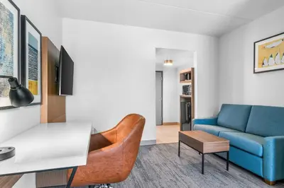 a living room with a couch and a table at Comfort Inn & Suites York North in York