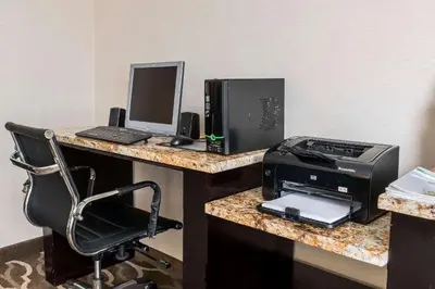 a desk with a printer and a computer on it at Comfort Inn - Pocono Mountains in White Haven