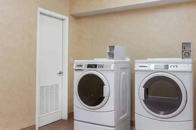 a washing machine and a dryer in a room at Comfort Inn - Pocono Mountains in White Haven