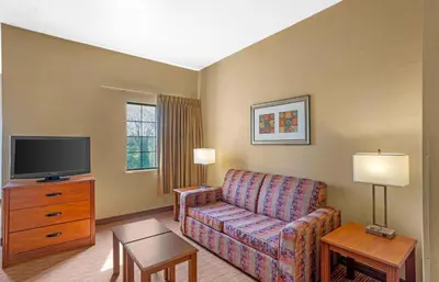 a living room with a couch and a tv at Extended Stay America Suites - Lancaster County in Mountville