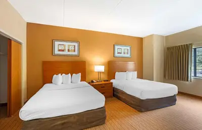 a hotel room with two beds and two lamps at Extended Stay America Suites - Lancaster County in Mountville