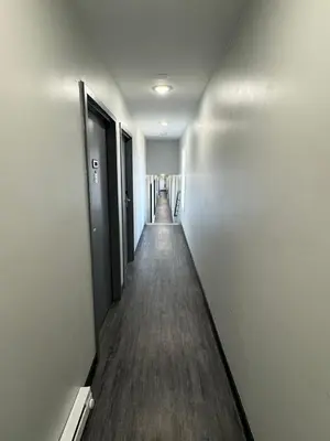 an empty hallway of an office building with a long corridor at Days Inn by Wyndham Moosic in Moosic