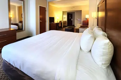 a large white bed in a hotel room at Comfort Inn & Suites Mount Pocono in Mount Pocono
