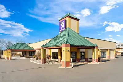 a building with a clock tower on top of it at Knights Inn Montgomeryville in Montgomeryville