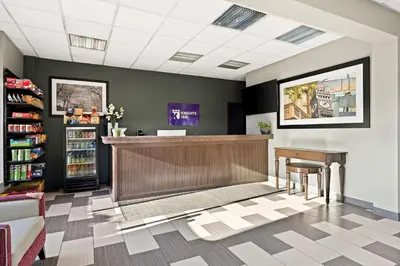 a lobby with a counter and a book shelf at Knights Inn Montgomeryville in Montgomeryville