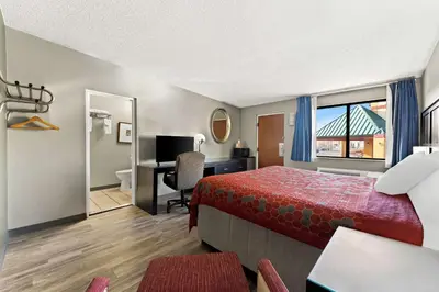 a hotel room with a bed and a desk at Knights Inn Montgomeryville in Montgomeryville