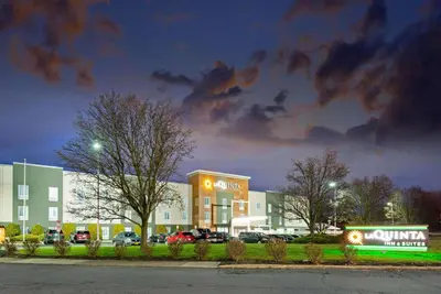 a building with cars parked in a parking lot at La Quinta by Wyndham New Cumberland - Harrisburg in New Cumberland