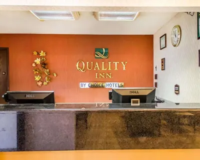 a waiting area of a quality inn sign on a wall at Quality Inn Harrisburg - Hershey Area in Harrisburg