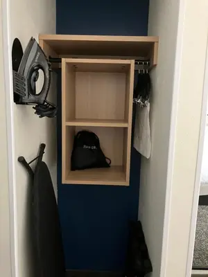 a shelf in a room with a bag in it at Spark by Hilton Clarks Summit in Clarks Summit