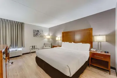 a hotel room with a large bed and a desk at Quality Inn Easton in Easton