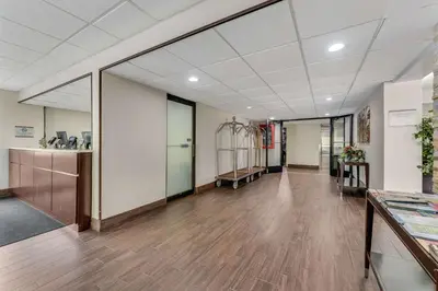 an office with a hallway with wooden floors and a room at Quality Inn Easton in Easton