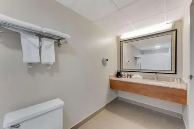 a bathroom with a sink and a mirror at Quality Inn Easton in Easton