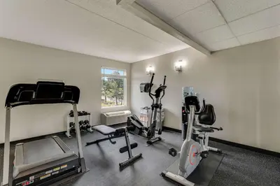a gym with several tread machines in a room at Quality Inn Easton in Easton