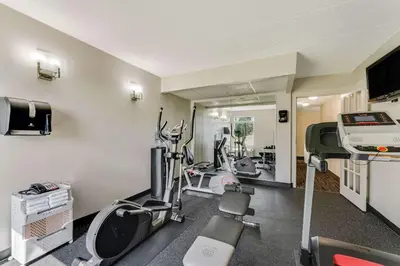 a gym with several treadmills and elliptical machines at Quality Inn Easton in Easton