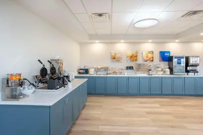 a large room with blue counters in a store at Comfort Suites Bloomsburg in Bloomsburg