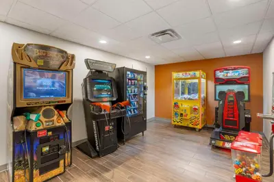 a room with arcade games and video game consoles at Comfort Suites Bloomsburg in Bloomsburg