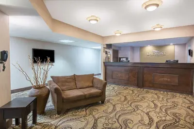 a waiting room with a chair and a desk at Baymont by Wyndham Bartonsville Poconos in Bartonsville