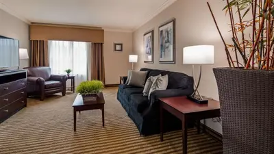 a living room with a couch and a table at Inn at Mendehall in Mendenhall