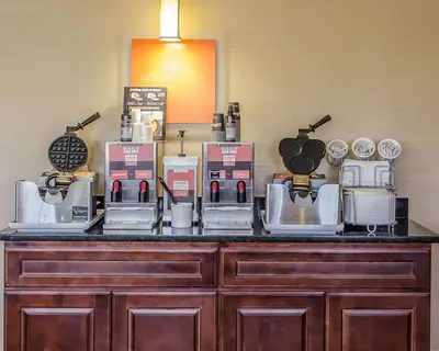 a counter with many coffee machines on it at SureStay Plus by Best Western Jonestown Lebanon Valley in Jonestown