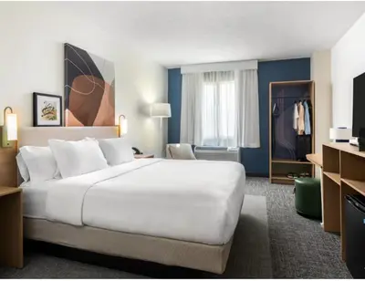 a large white bed in a hotel room at Spark By Hilton Exton in Exton