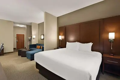 a large white bed in a hotel room at Comfort Suites Hummelstown - Hershey in Hummelstown