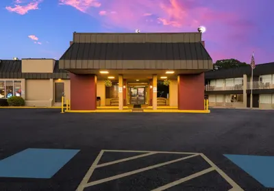 a parking lot in front of a motel at Red Roof Inn Reading in Reading