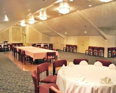 a banquet hall with white tables and chairs at Rodeway Inn & Suites Myerstown - Lebanon in Myerstown