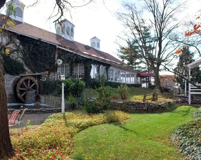 a house with a garden in front of it at Rodeway Inn & Suites Myerstown - Lebanon in Myerstown