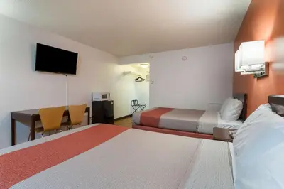 a hotel room with two beds and a desk at Motel 6-Frackville, PA in Frackville
