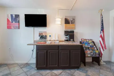 a counter in a room with an american flag at Motel 6-Frackville, PA in Frackville