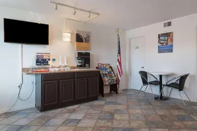 a kitchen with a counter and a table and chairs at Motel 6-Frackville, PA in Frackville