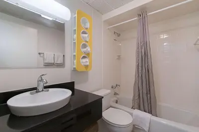 a white bathroom with a sink and a toilet at Motel 6-Frackville, PA in Frackville