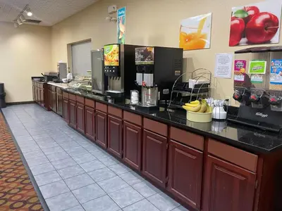 a long counter in a restaurant with bananas on it at Wilkes-Barre Inn & Suites in Wilkes-Barre