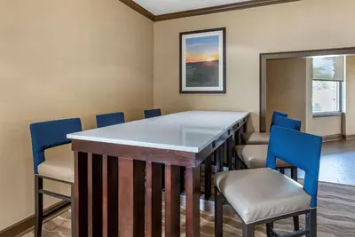 a conference room with a table and chairs at Comfort Inn Lancaster County North in Denver