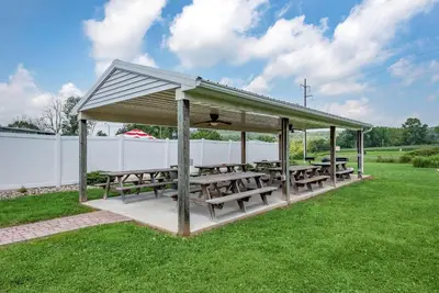 a gazebo with picnic tables on a lawn at Comfort Inn Lancaster County North in Denver