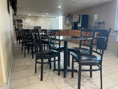 a dining room with a table and chairs at Comfort Inn Dunmore - Scranton East in Dunmore