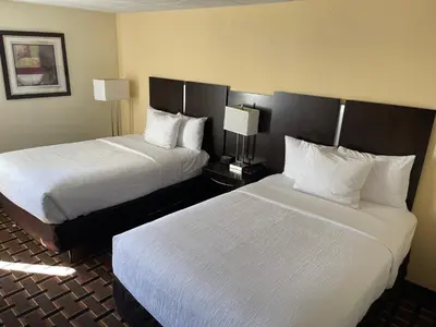 a hotel room with two beds and two lamps at Comfort Inn Dunmore - Scranton East in Dunmore